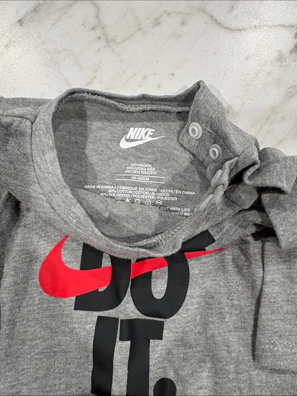 Nike Gray Baby One-Piece with Red Swoosh 'Just Do It'